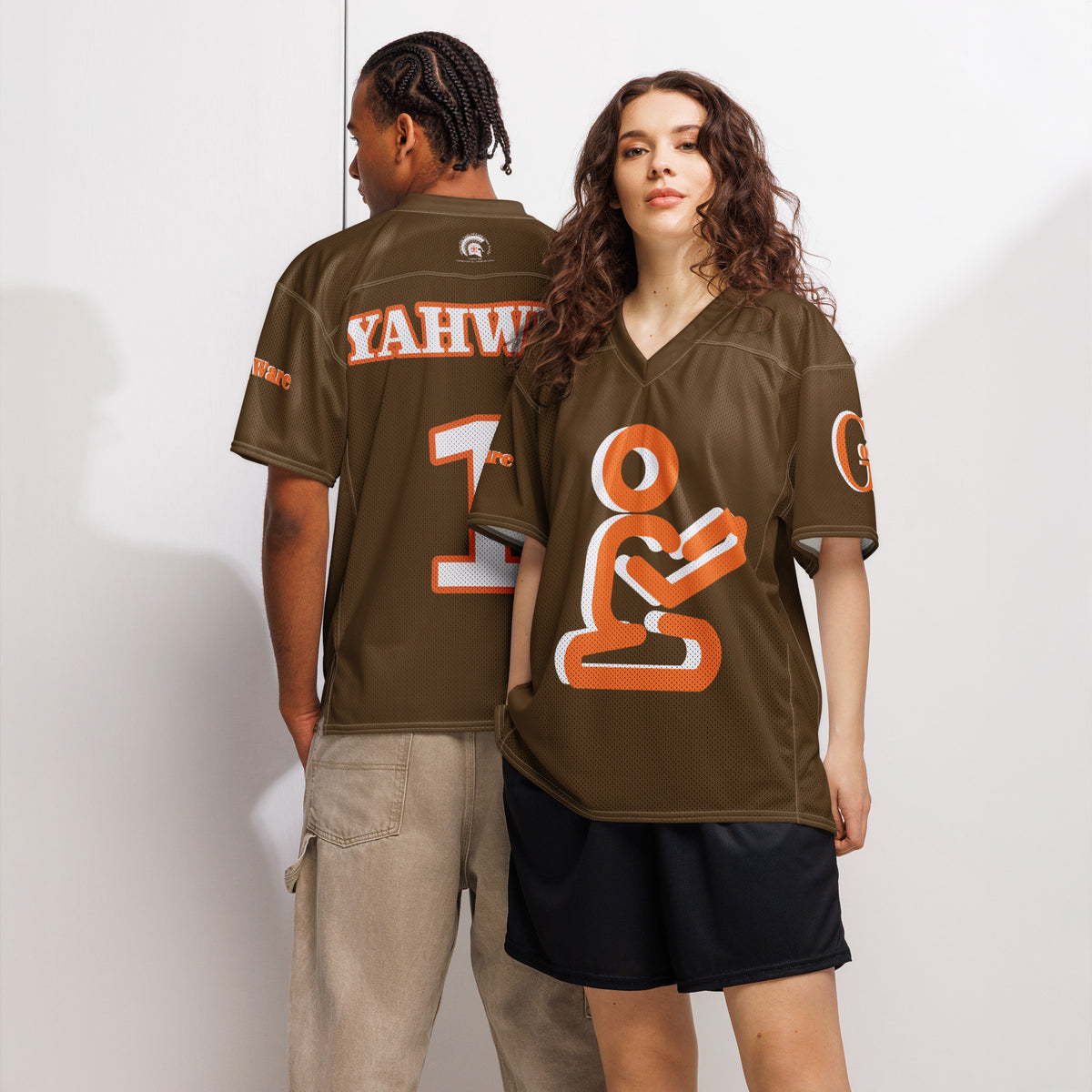 Two models wearing Yahweh Christian football jersey in orange and white on brown, showcasing faith and style.