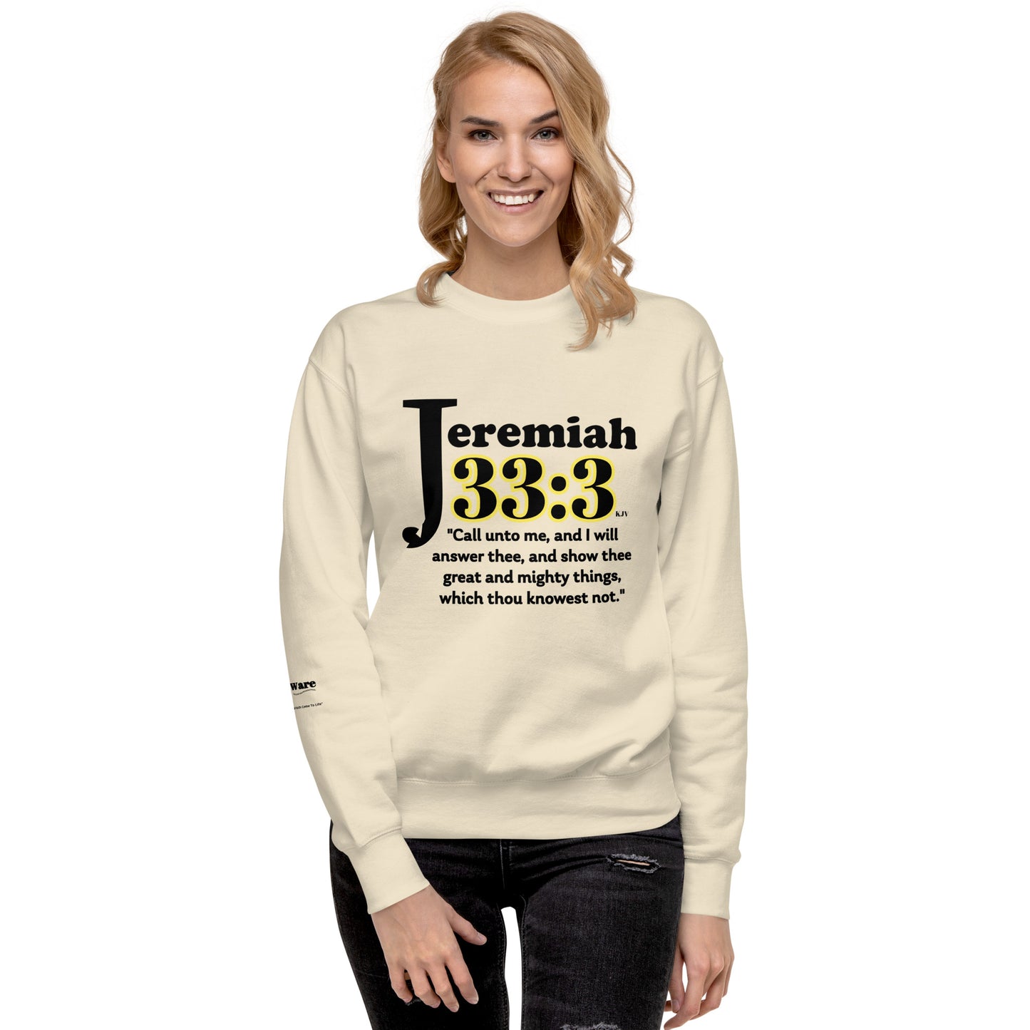woman standing with cream shirt; scripture on shirt