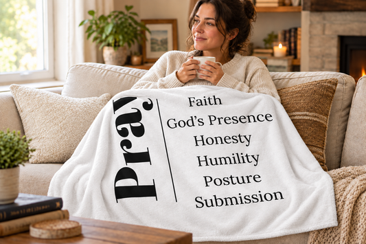 Adult with Prayer throw blanket showing the word Prayer clearly