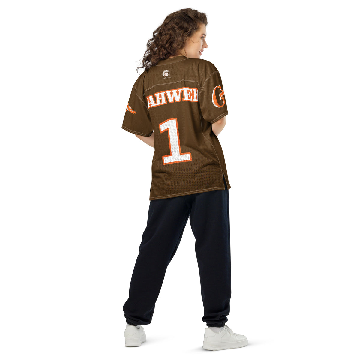 Rear view of a person wearing a Yahweh Christian football jersey in orange and white on brown, showcasing comfort and style.