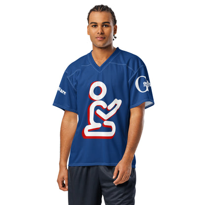 Model wearing royal blue Christian football jersey with white-and-red praying figure