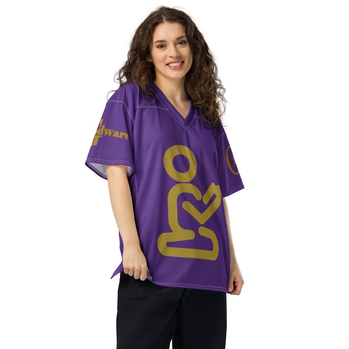 Woman wearing Yahweh Christian football jersey in purple and gold. Stylish and faith-focused design.