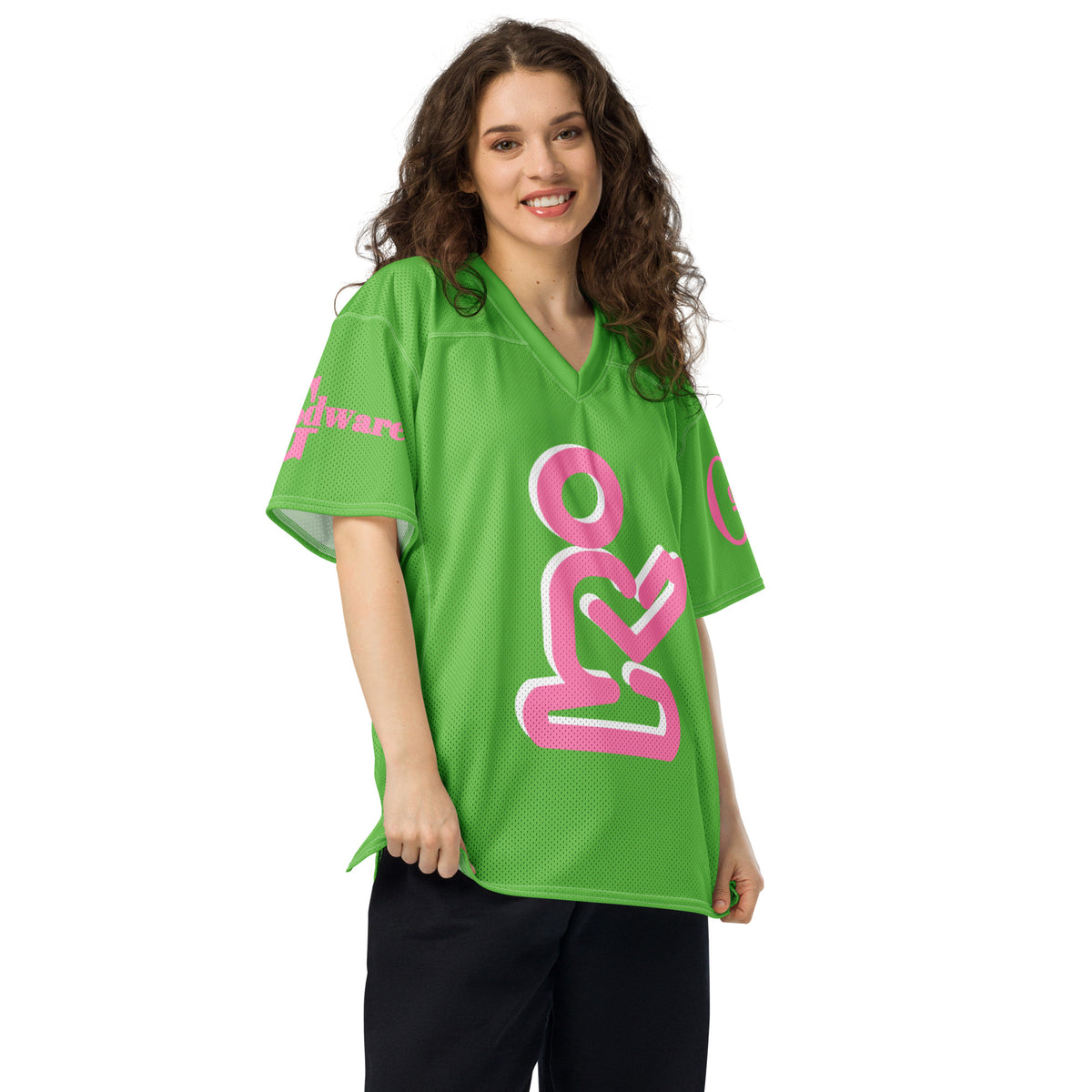 Christian Yahweh football jersey in bright green with pink details and GodWare branding worn by a woman.