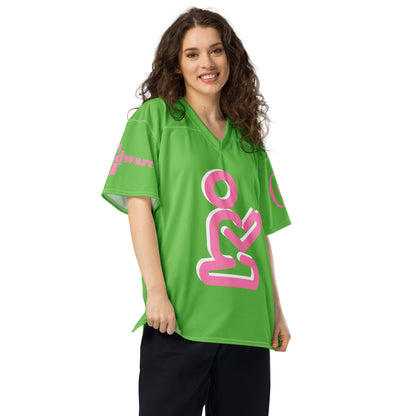 Christian Yahweh football jersey in bright green with pink details and GodWare branding worn by a woman.