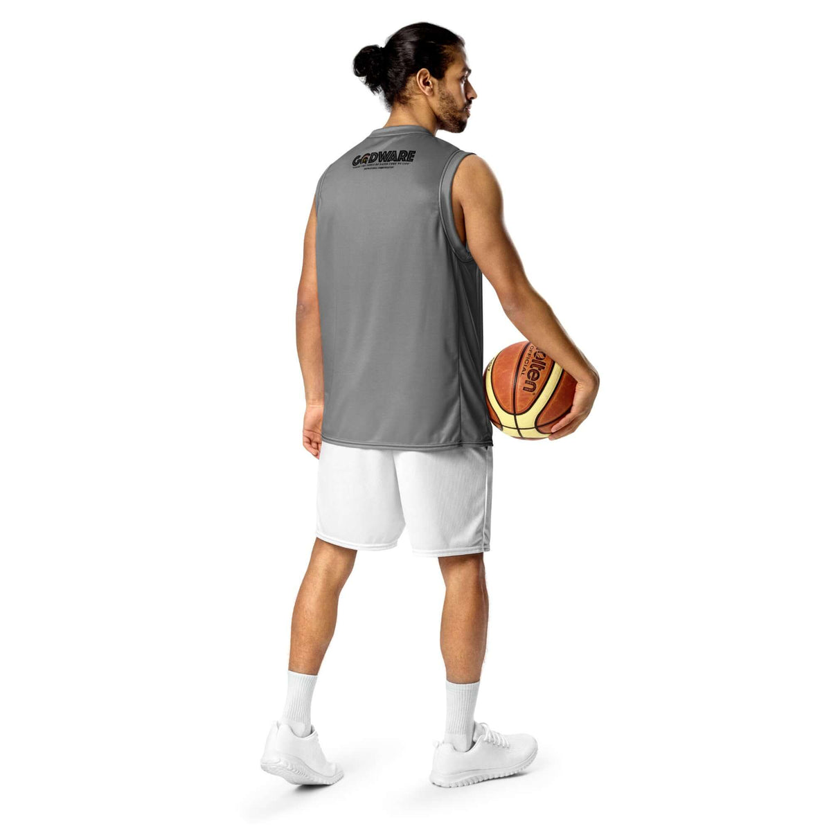 Man in a grey Pray Christian Grey recycled mesh basketball jersey holding a basketball from behind.