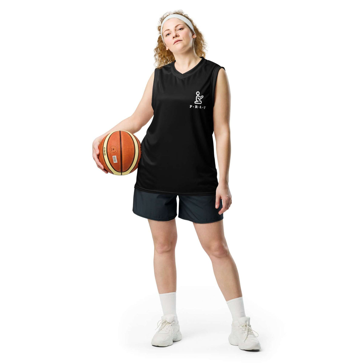 Pray Christian black mesh basketball jersey worn by a female player holding a basketball, showcasing sporty style and faith inspiration.