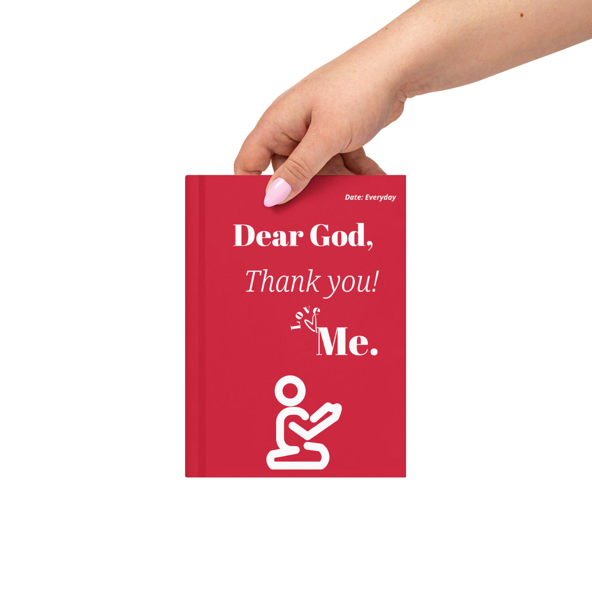 Hand holding the red Dear God Christian journal with ivory gratitude lettering and a kneeling prayer figure.