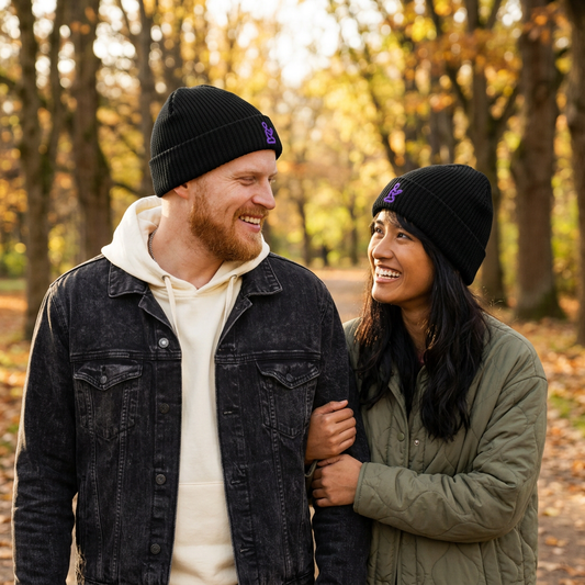 Man and woman wearing GodWare black Pray fisherman beanies on an autumn walk