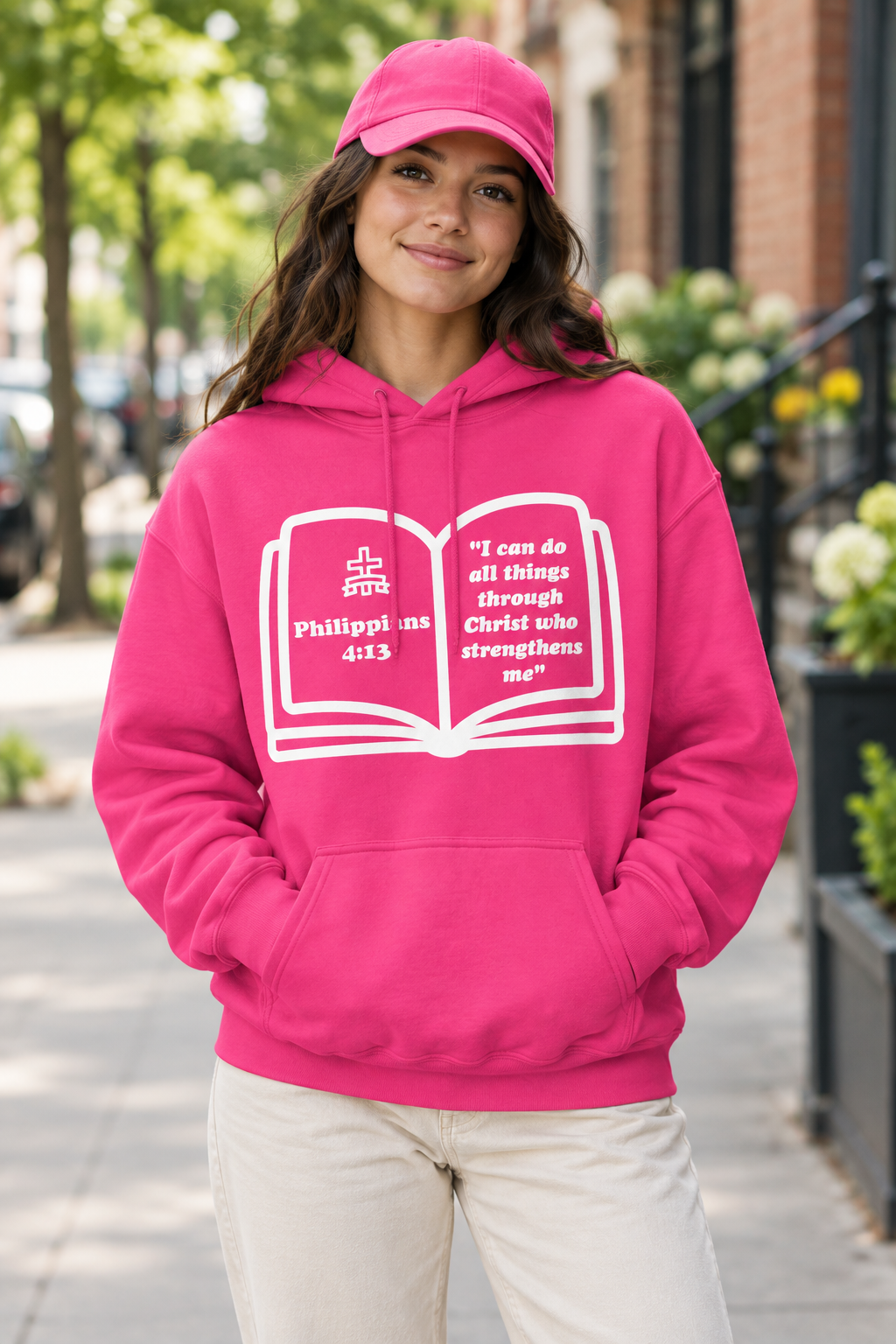 Model wearing the heliconia hoodie and matching dad cap