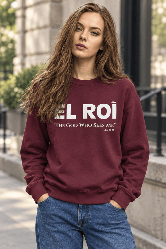 Woman wearing burgundy El Roi sweatshirt